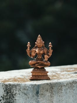 Detailed brass statue of a Hindu deity showcasing fine artisanal craftsmanship, set in Bengaluru, India.
